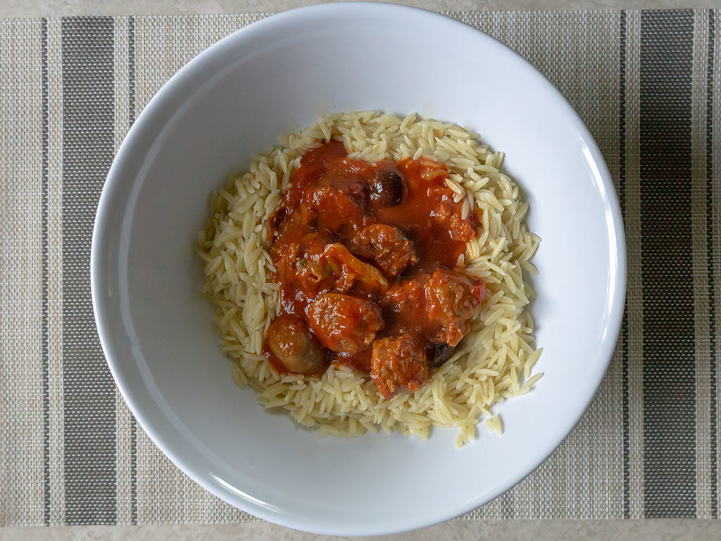 Johnsonville sausage in Newmans tomato sauce with orzo pasta