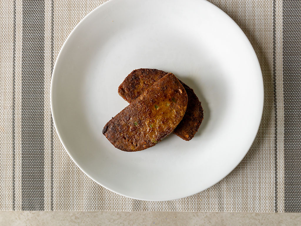 Gardein Home Style Meatless Meatloaf cooked in the pan and plated