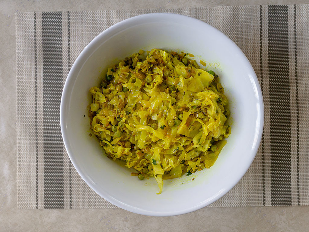 Indian cabbage and peas cooked and plated