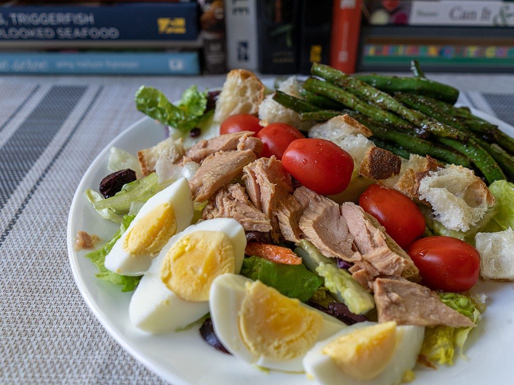 Tonnino Tuna Fillets In Olive Oil nicoise salad side view