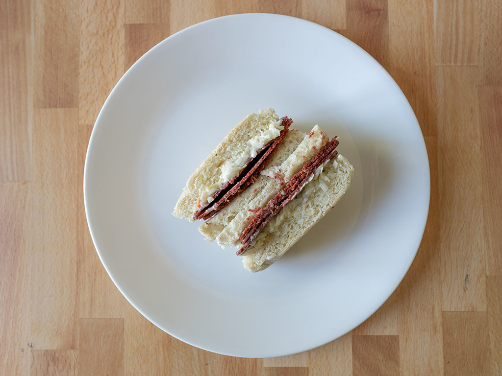 Worthington Meatless Corned Beef on white bread with slaw