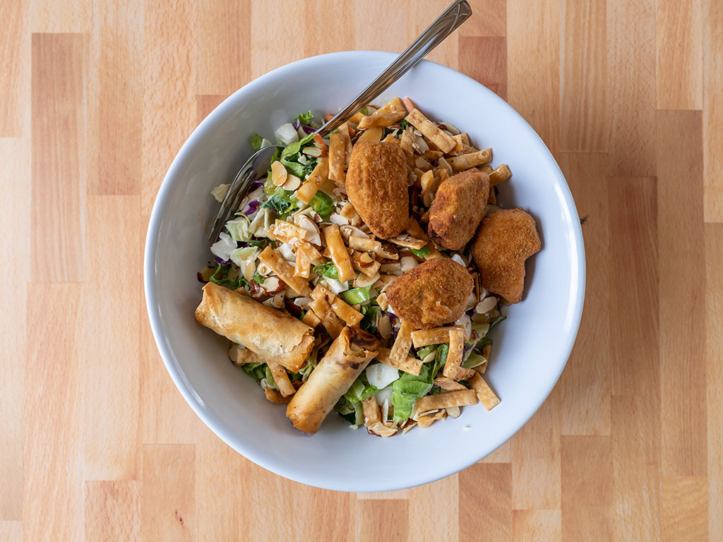 Royal Asia Vegetable Spring Rolls on Asian salad with incogmeato nuggets