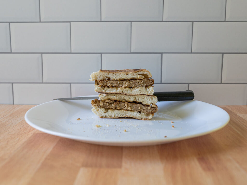 Simple Truth Meatless Breakfast Patties air fried on English muffin interior stacked