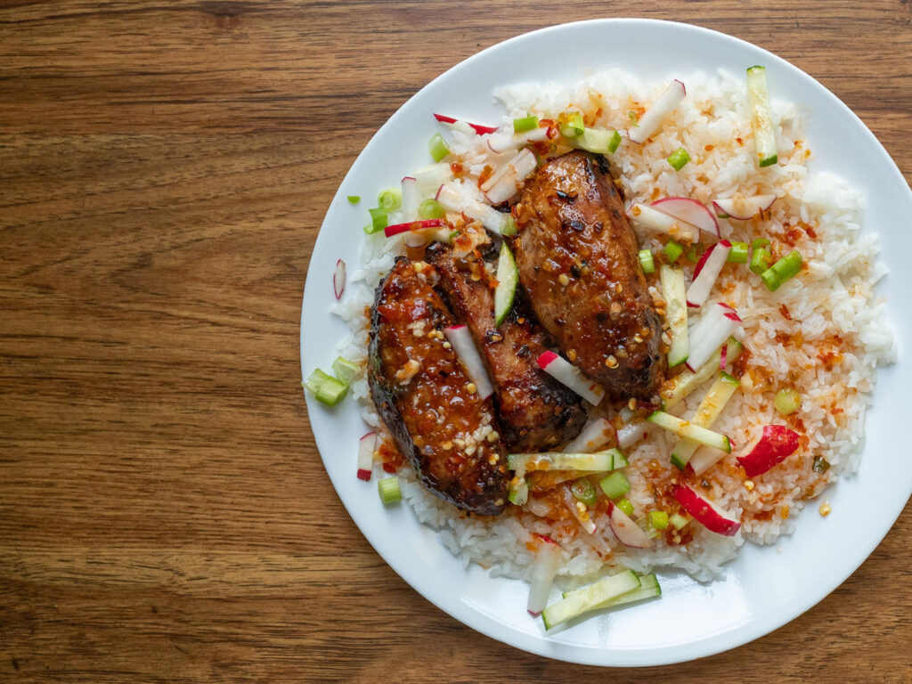 Me's Way Chili Sauce marinated country style ribs over rice