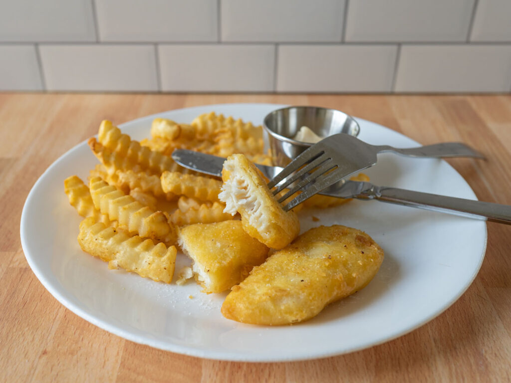 Pacific Crispy Battered Halibut with fries interior