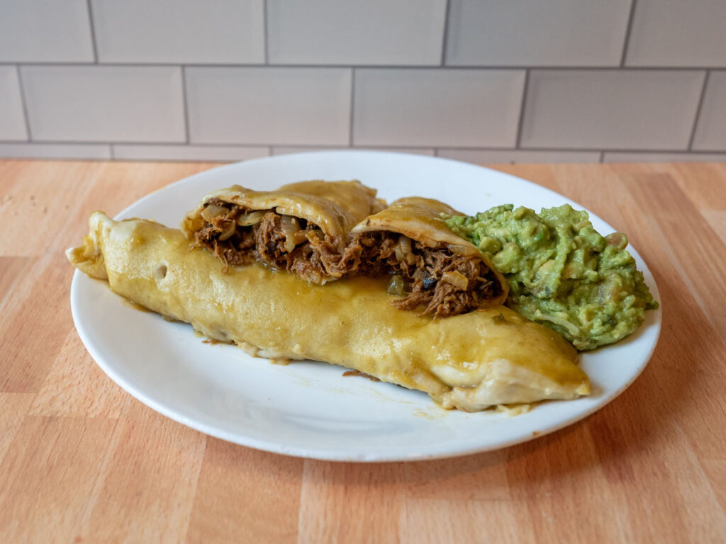 Del Real Barbacoa cooked in hatch green Chile enchilada