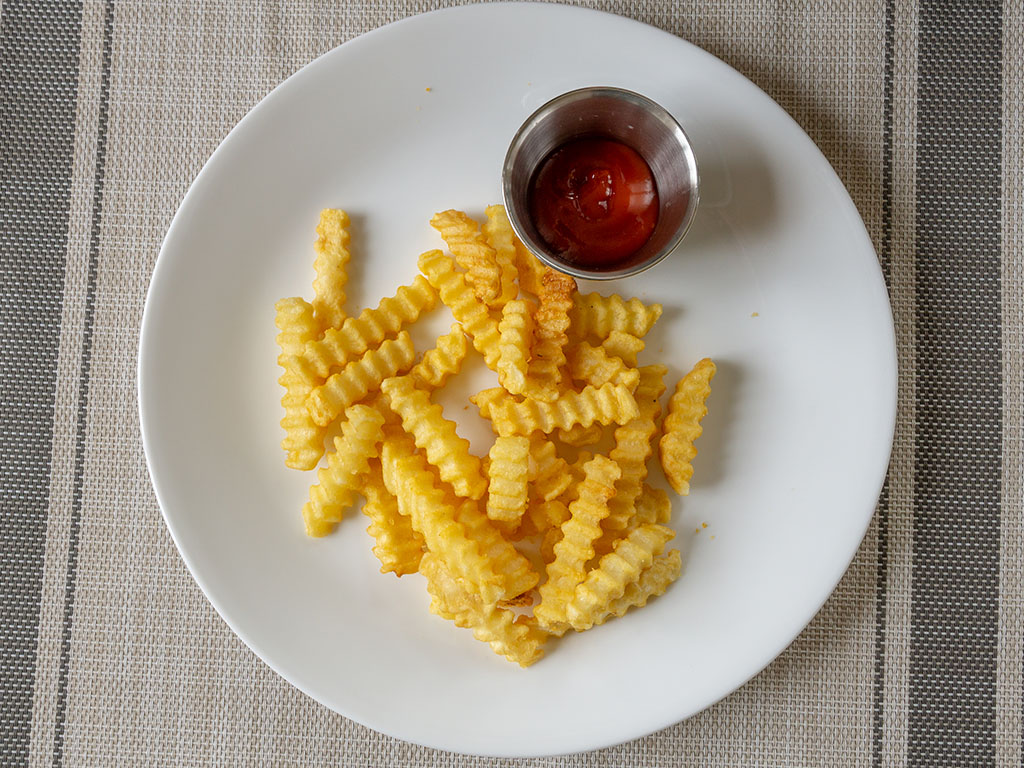 Ore-Ida Extra Crispy Crinkle French Fries cooked with ketchup